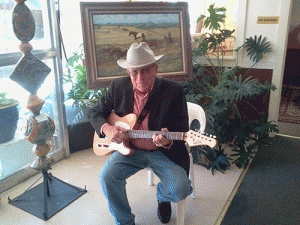 Trinidad musician, Ed Shaw, performing in L&L Fine Art Gallery at a Last Friday Art Walk. Photo by Lucky Murphy. 